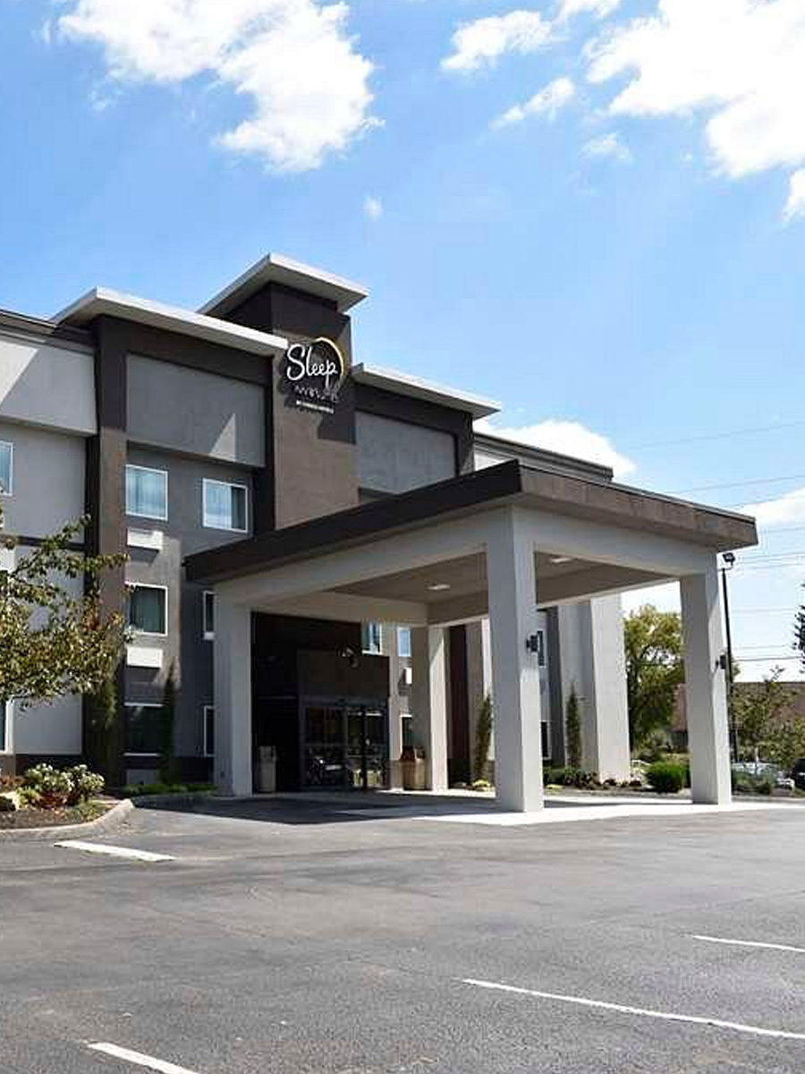 Exterior view of Sleep Inn & Suites West Knoxville, highlighting the inviting entrance and hotel signage