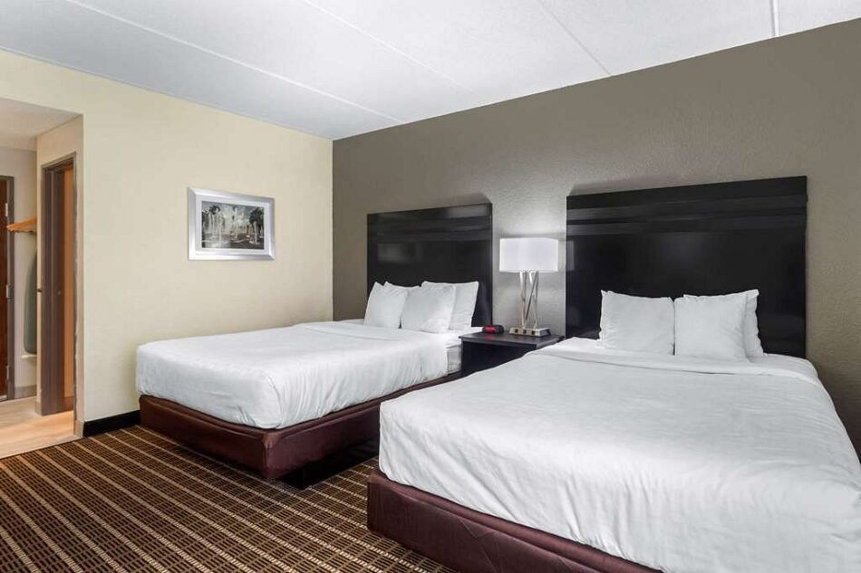 Modern 2 Queen Bed Suite featuring stylish decor and comfortable furnishings at Sleep Inn & Suites